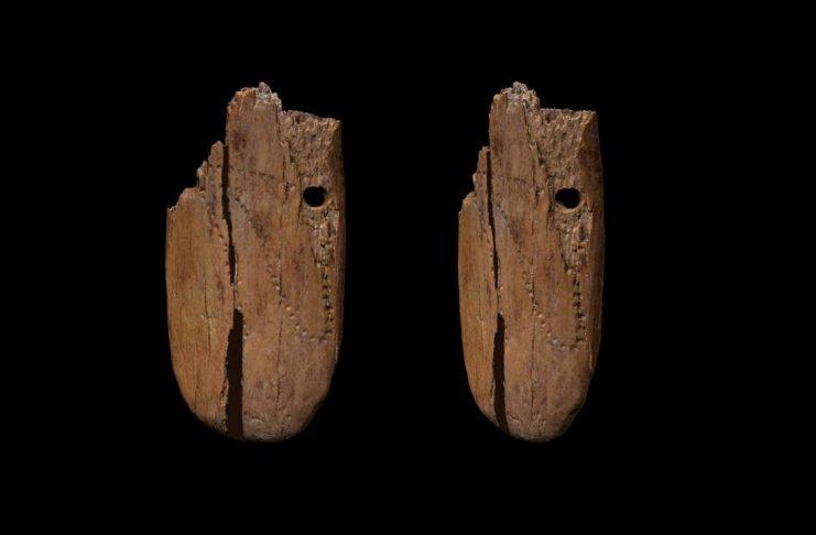 MAMMOTH IVORY PENDANT MAY BE EARLIEST DECORATED JEWELLERY FOUND IN EURASIA