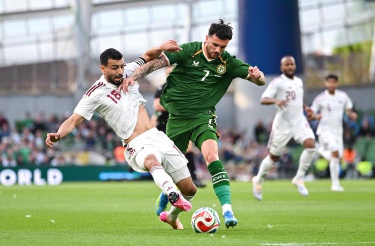 Collins header gives Ireland victory as protests and red cards dominate 