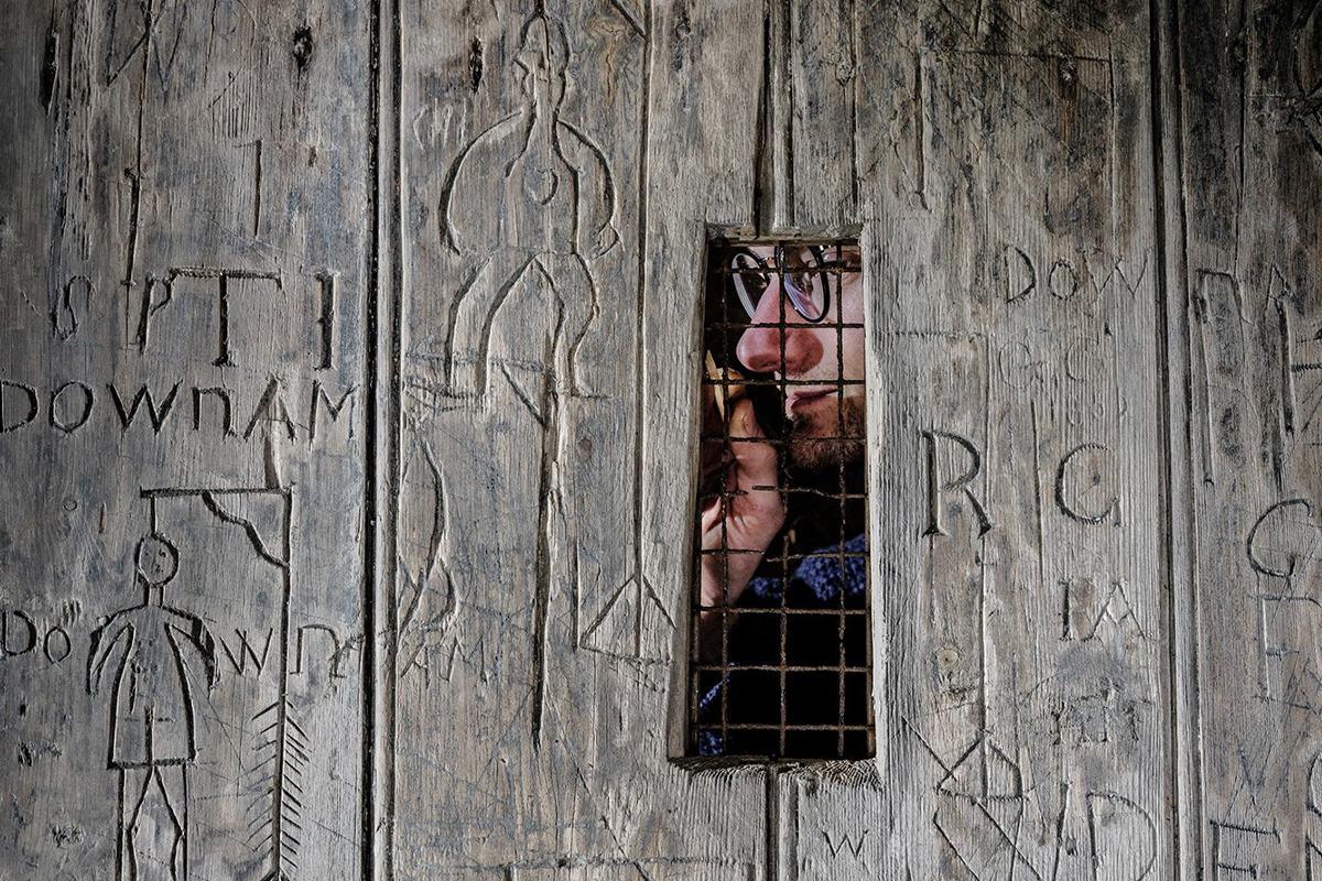 Soldiers’ graffiti depicting hangings found on door at Dover Castle