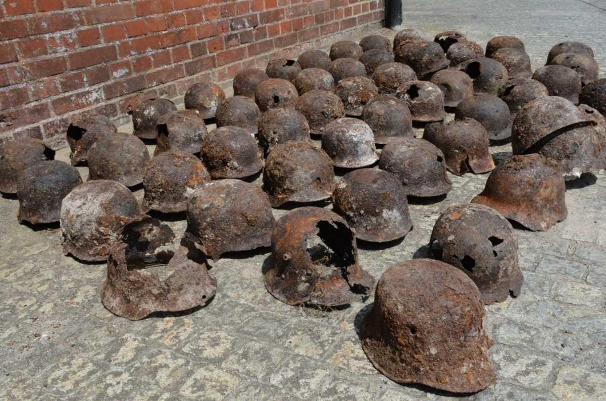 Cache of military helmets from both World Wars discovered during roadworks