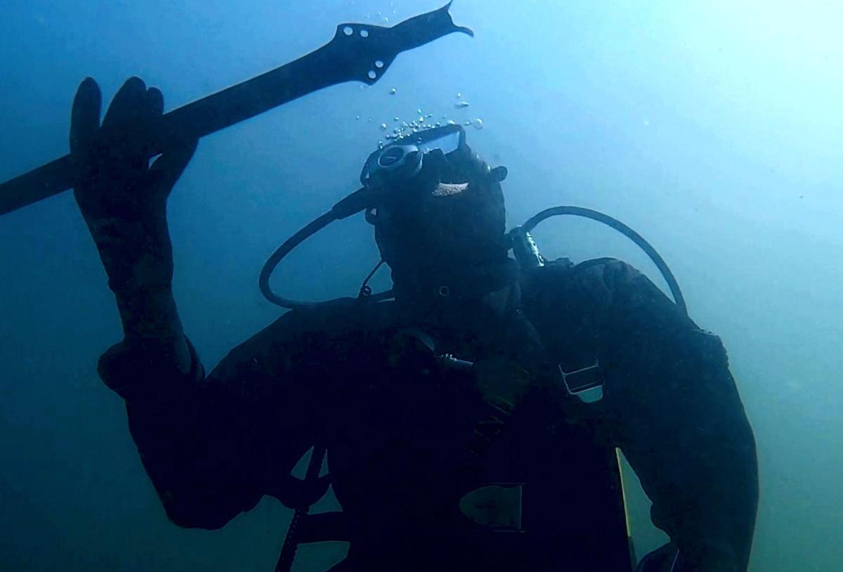 3,000-year-old bronze sword discovered in submerged settlement in Italy