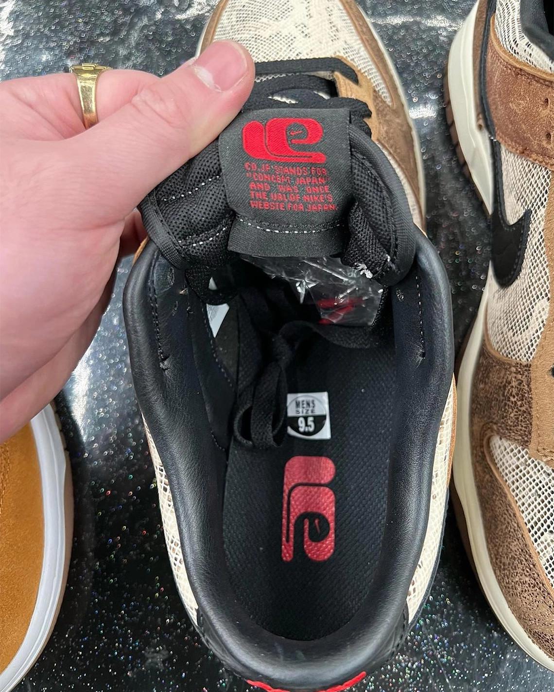 Les logos rétro de Nike marquent cette Dunk Low CO.JP multitexturé. Les logos rétro de Nike marquent cette Dunk Low CO.JP multitexturé.