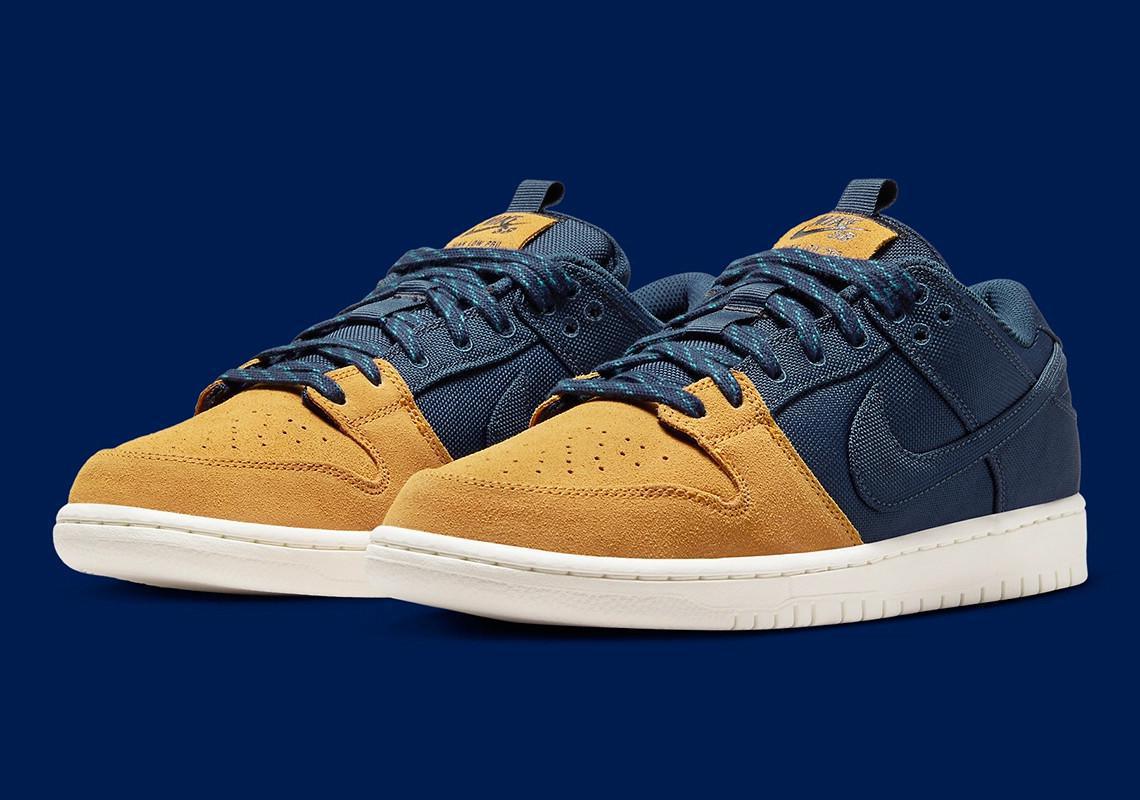 Poches de rangement et construction se rejoignent sur la Nike SB Dunk Low "Midnight Navy/Ochre". Poches de rangement et construction se rejoignent sur la Nike SB Dunk Low "Midnight Navy/Ochre".