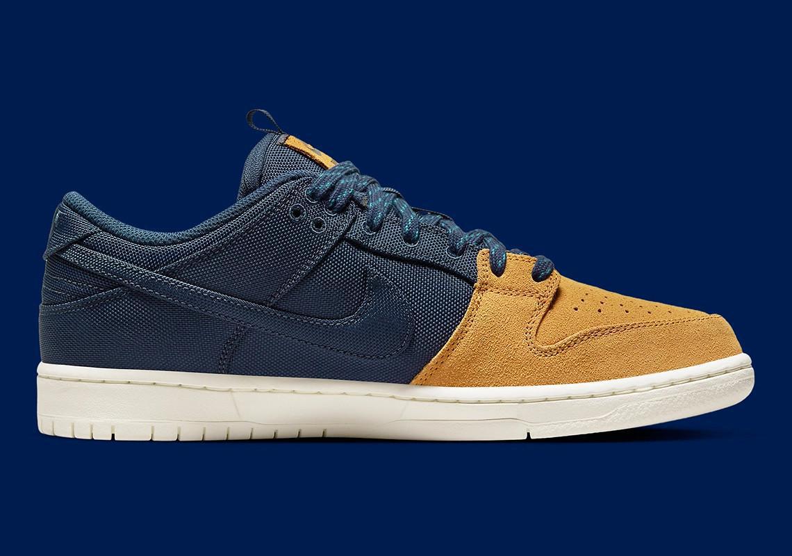 Poches de rangement et construction se rejoignent sur la Nike SB Dunk Low "Midnight Navy/Ochre". Poches de rangement et construction se rejoignent sur la Nike SB Dunk Low "Midnight Navy/Ochre".
