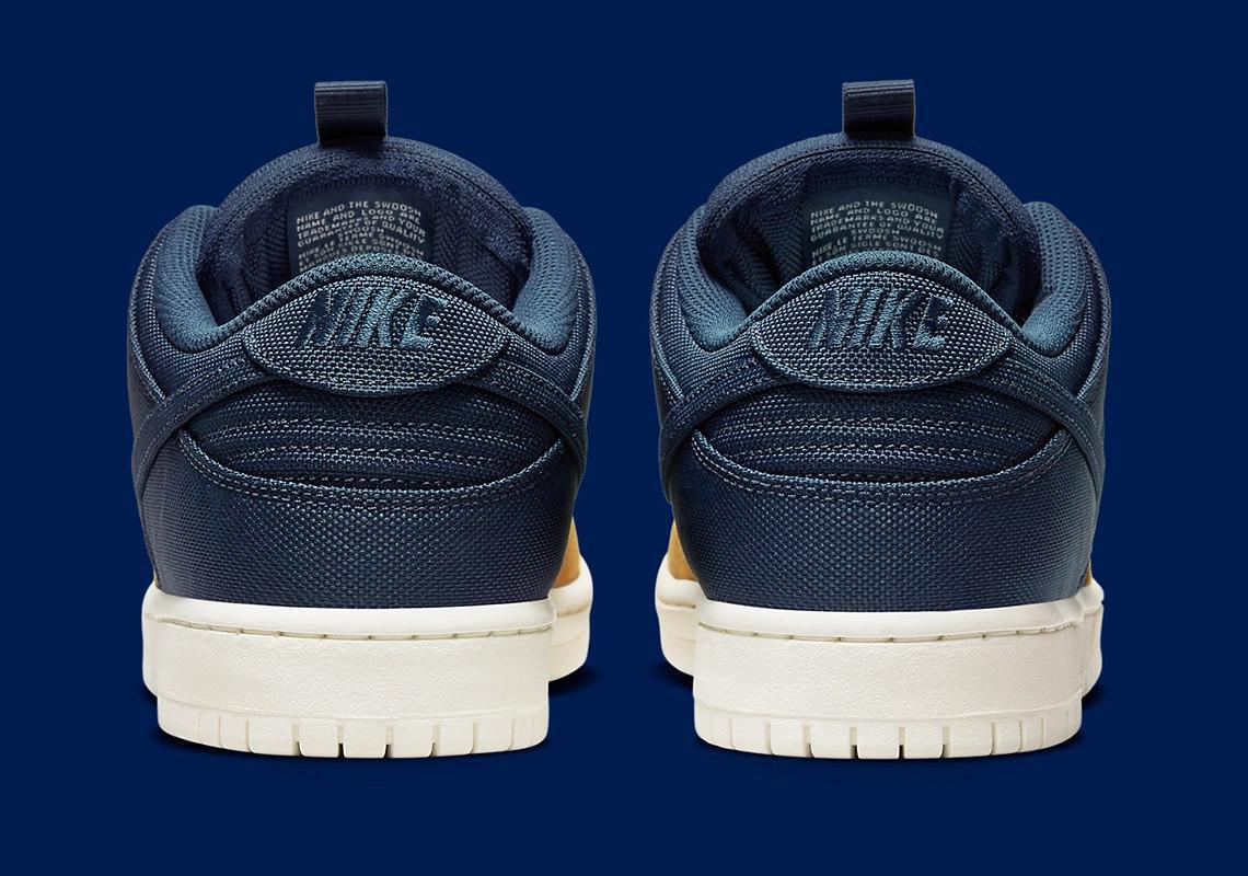 Poches de rangement et construction se rejoignent sur la Nike SB Dunk Low "Midnight Navy/Ochre".