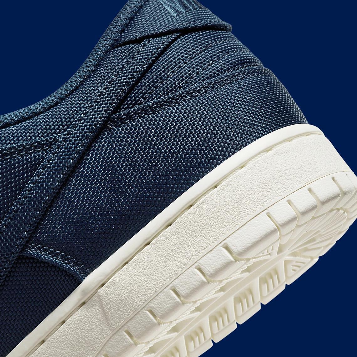 Poches de rangement et construction se rejoignent sur la Nike SB Dunk Low "Midnight Navy/Ochre". Poches de rangement et construction se rejoignent sur la Nike SB Dunk Low "Midnight Navy/Ochre".