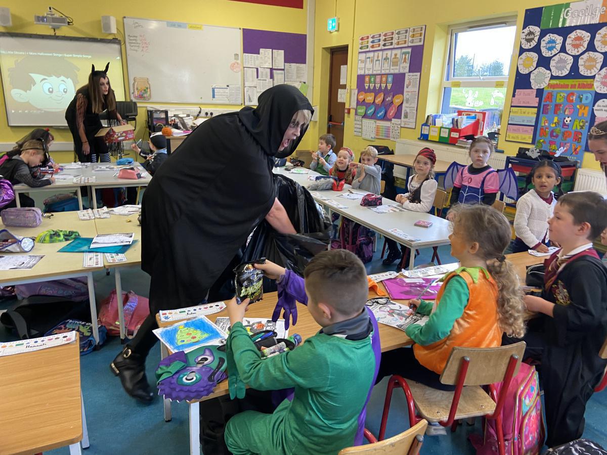 ‘Three witches from the Parents council visited the school this afternoon to wish all the children a happy Halloween and midterm. They also gave every child some spooky treats to enjoy