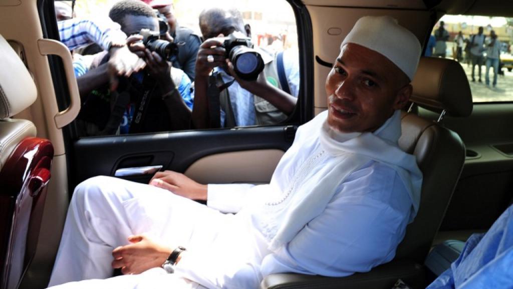 Karim Wade à son arrivée à l'audition devant la Cour de répression de l'enrichissement illicite à Dakar, le 15 mars 2013. AFP/SEYLLOU