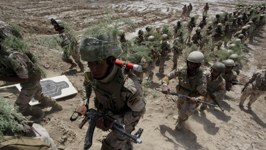 Des membres des forces de sécurité irakiennes à l'entraînement, le 9 avril à Jurf al-Sakhar. REUTERS/Alaa Al-Marjan