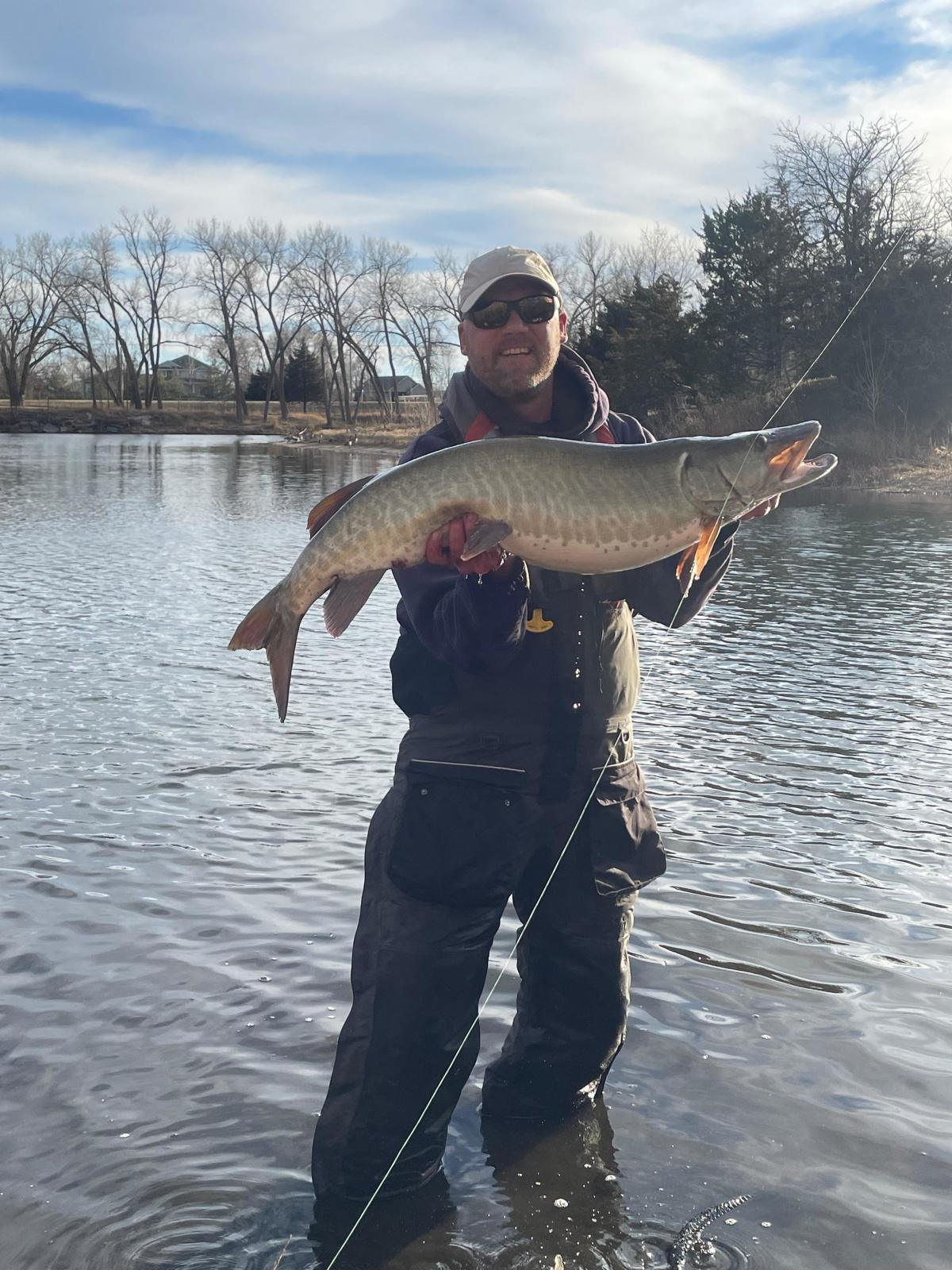 ebraska small lake fat musky on walleye kracken with white curly grub tail