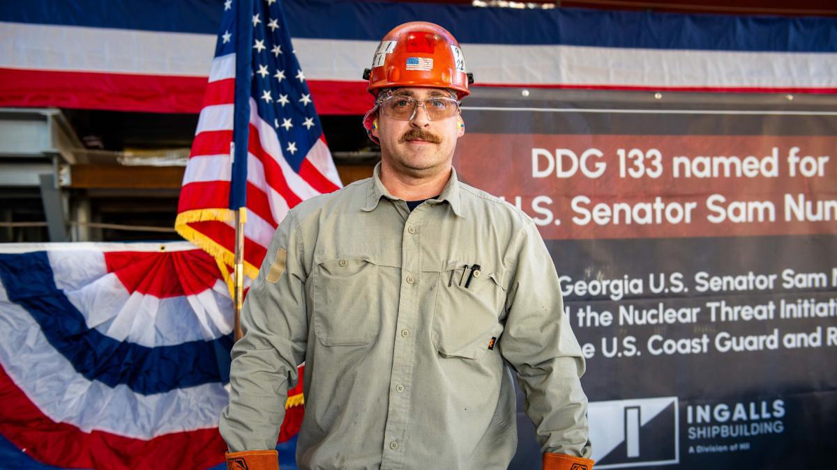 Structural welder etches namesake's initials into DDG 133 keel plate