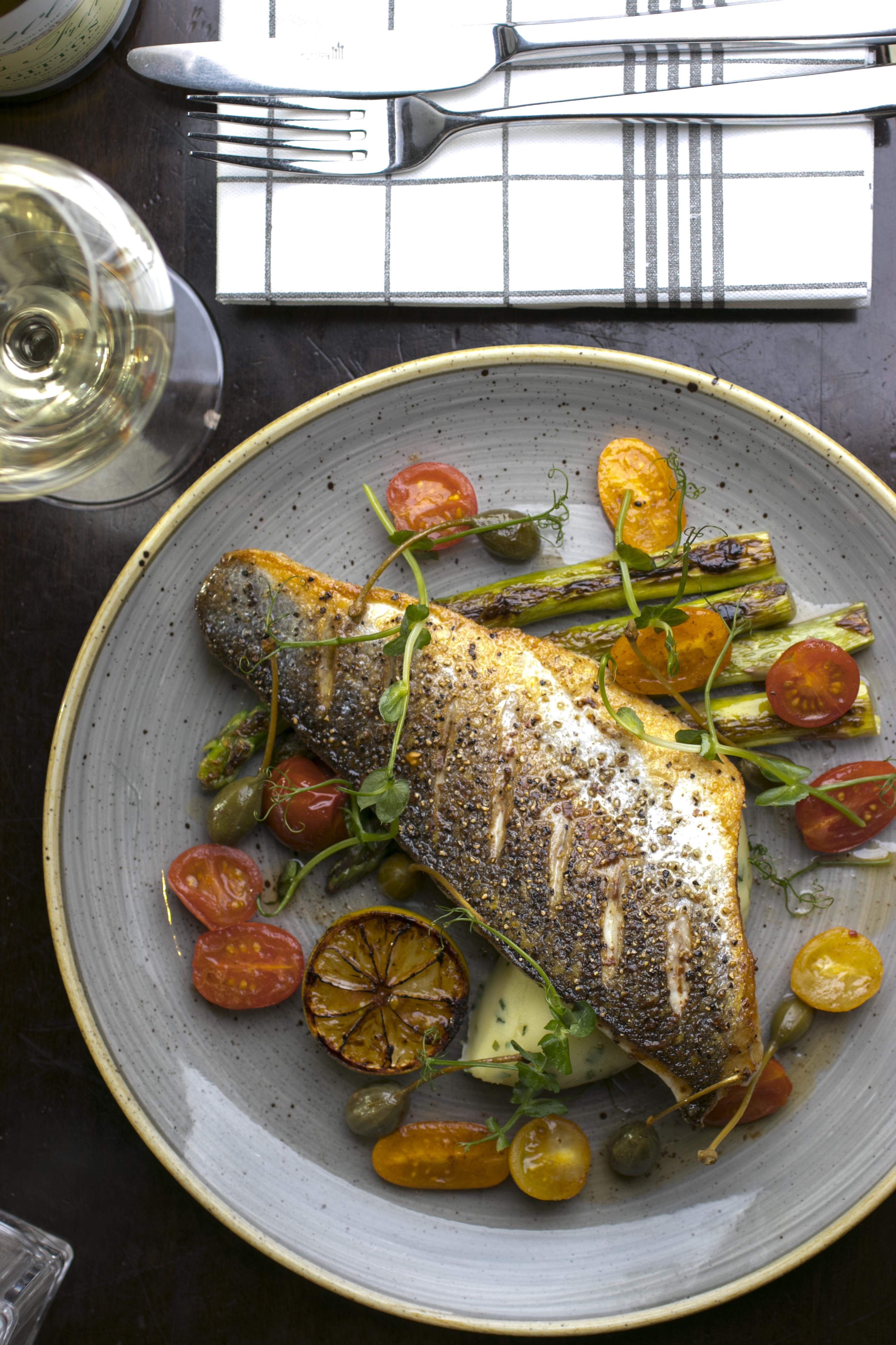 Pan-fried Fillet of Hake, grilled asparagus, heirloom cherry tomato and capers dressing 