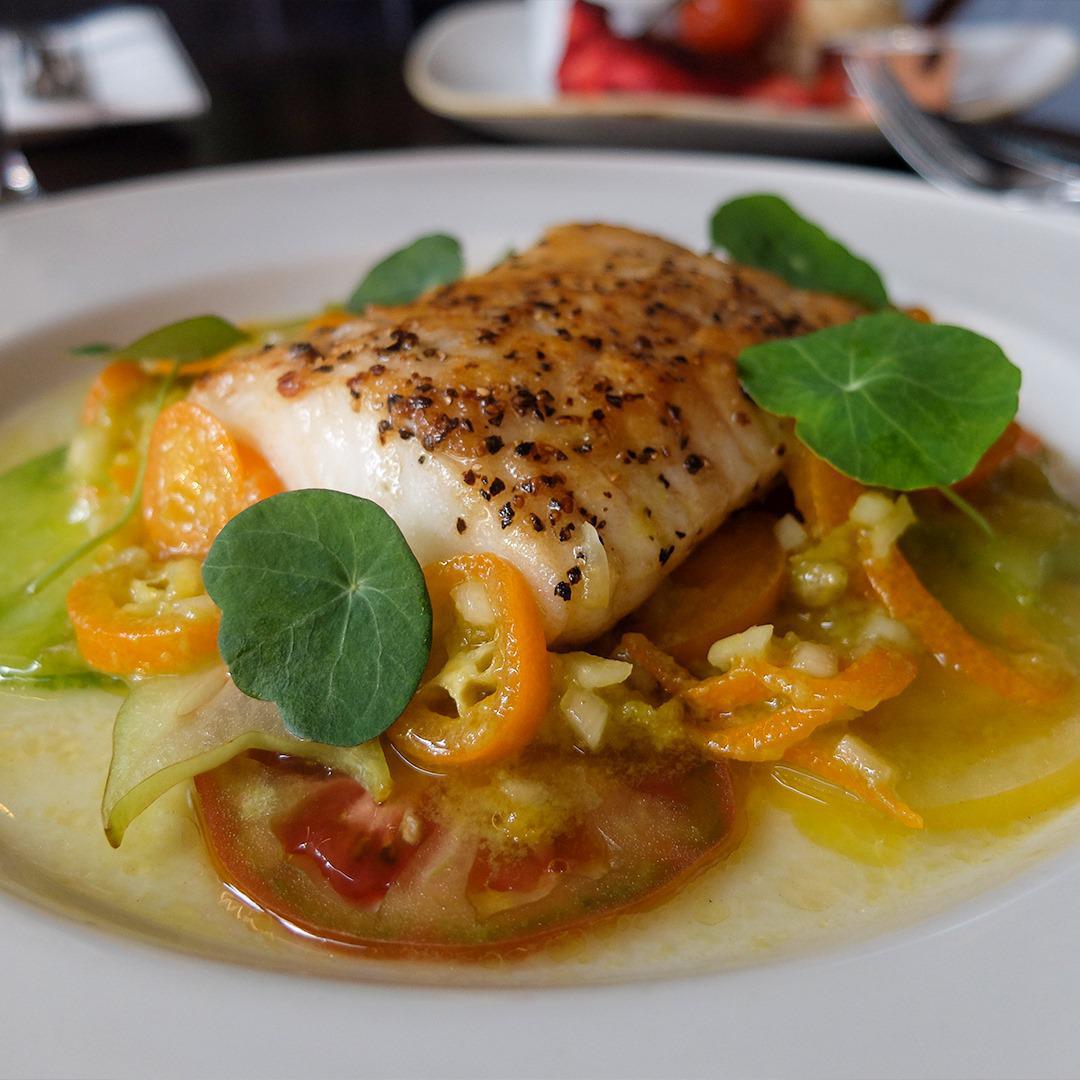 Pan-fried Turbo, heirloom tomato, kumquat dressing & starfruit.