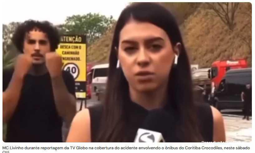 MC Livinho interrompe reportagem da Globo sobre tragédia com dança, gerando críticas nas redes sociais." MC Livinho interrompe reportagem da Globo sobre tragédia com dança, gerando críticas nas redes sociais."