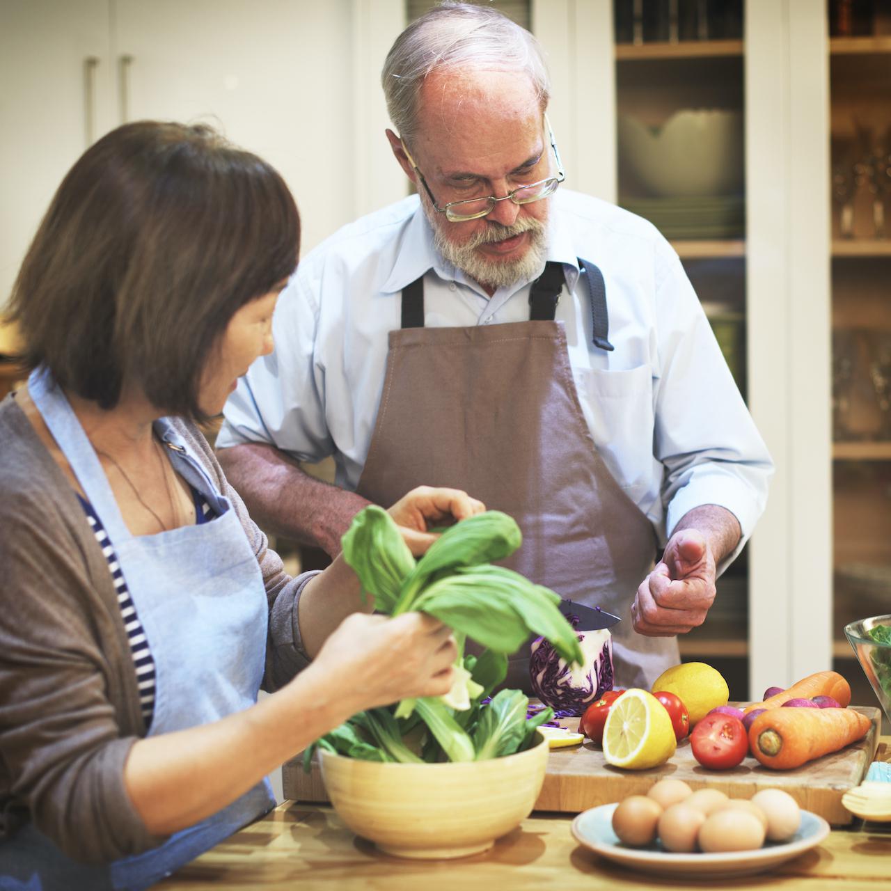 couple-helping-cooking-preparation-concept-PDYFEYW