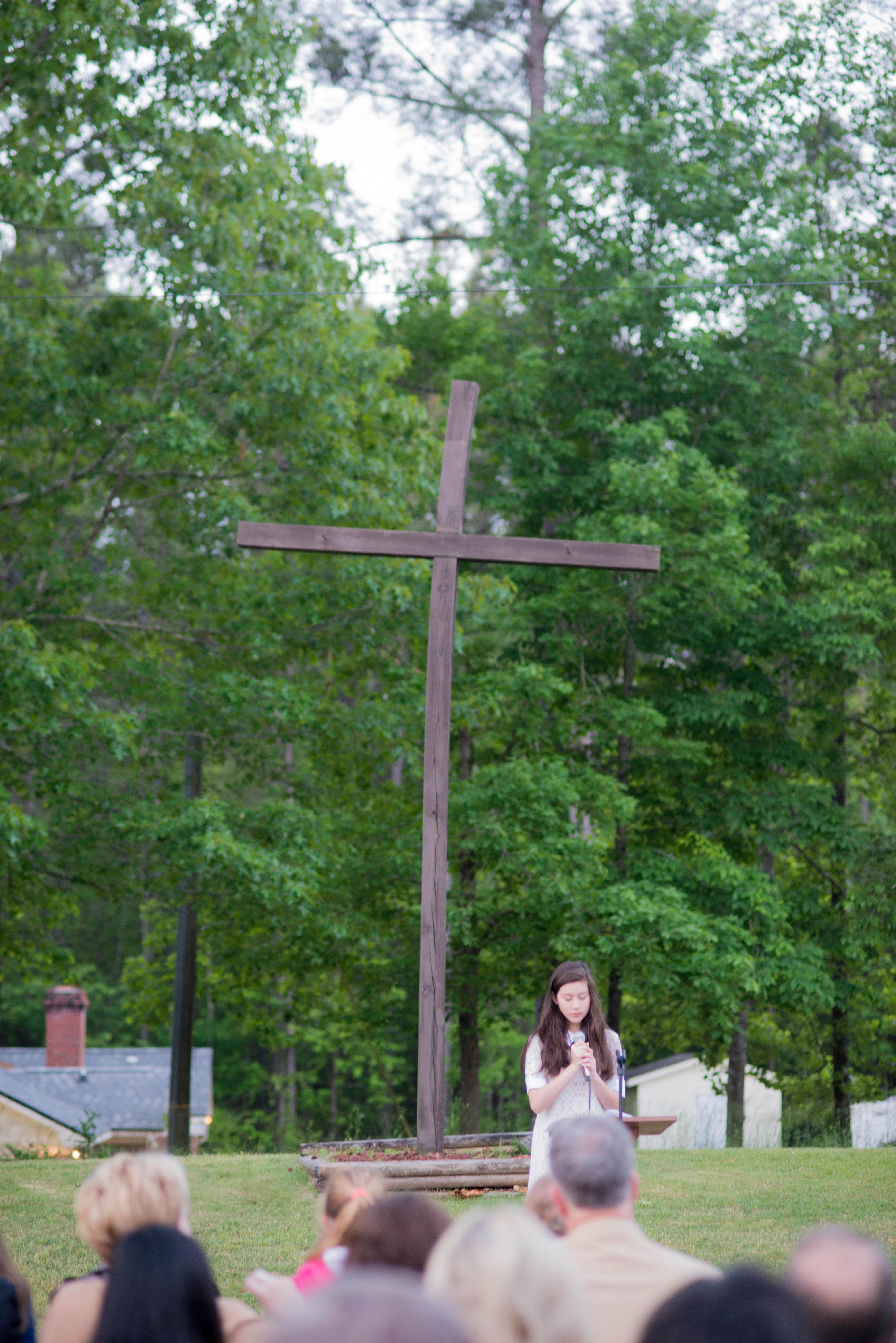 Cross with people in front