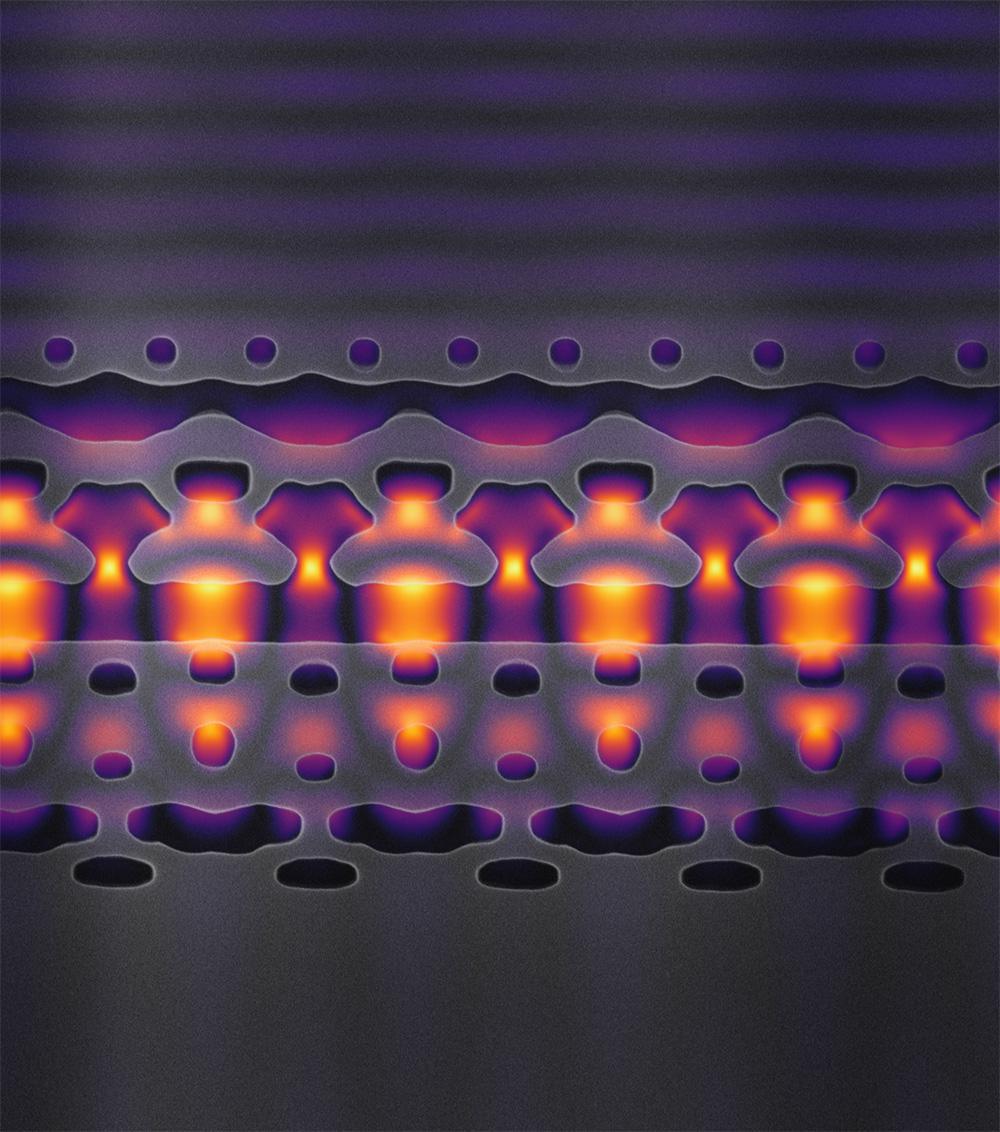 Esta imagen, ampliada 25.000 veces, muestra una sección de un acelerador en un chip de silicio. Las estructuras grises enfocan la luz láser infrarroja (mostrada en amarillo y morado) en los electrones que fluyen a través del canal central. Imagen: cortesía de Neil Sapra.