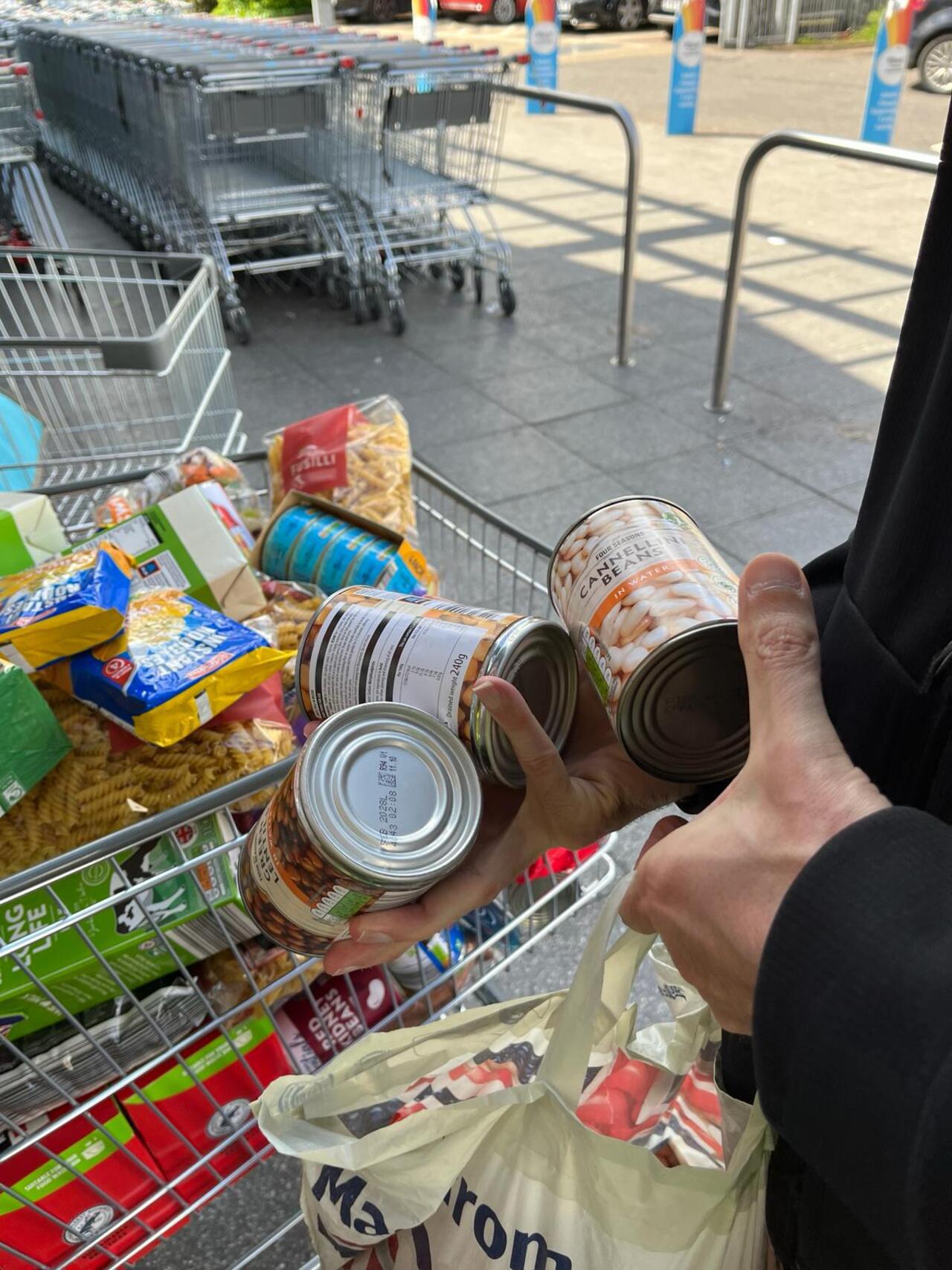 Public donating non perishables at a Shop and Drop Challenge