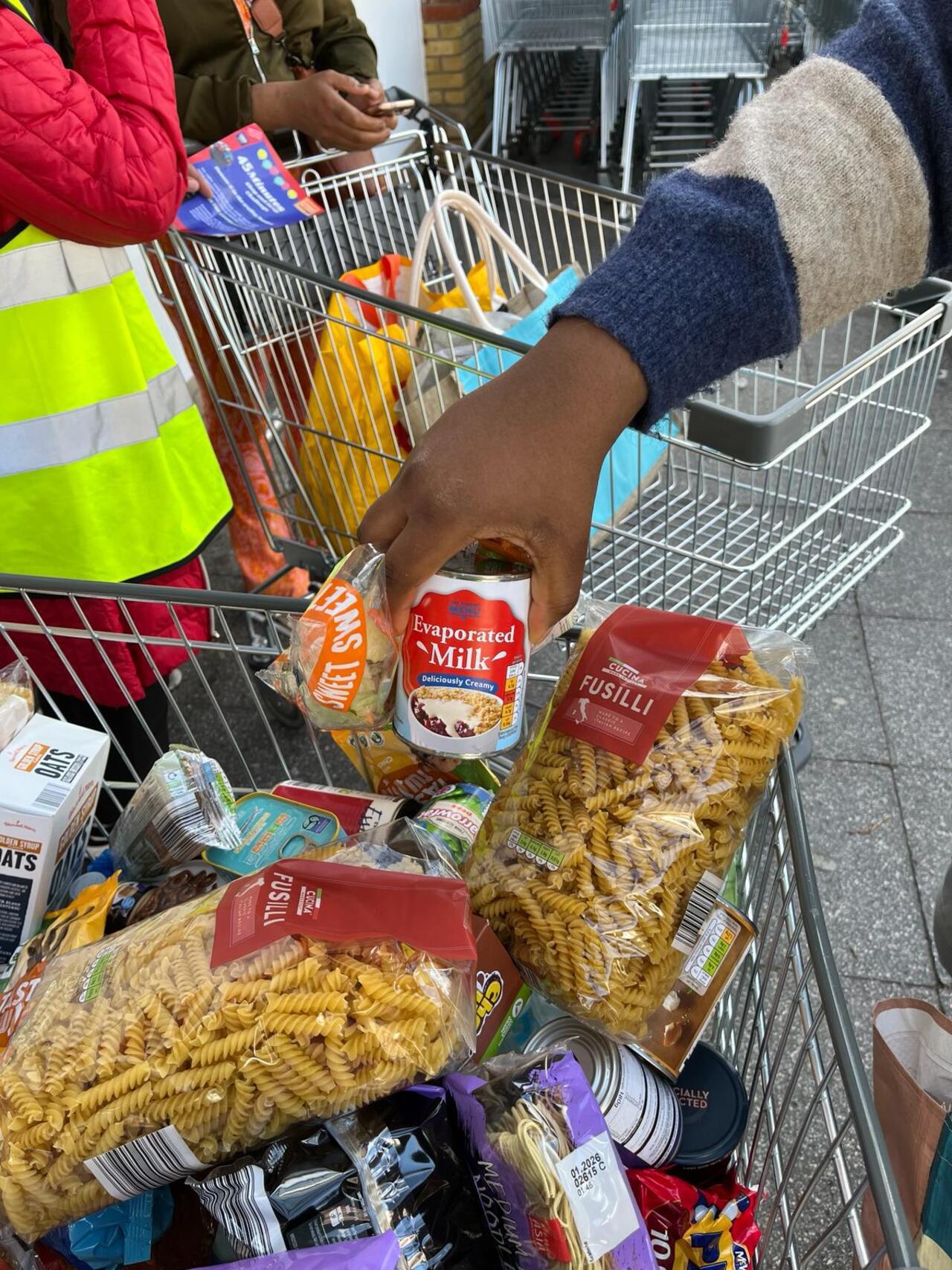 Public donating non perishables at a Shop and Drop Challenge