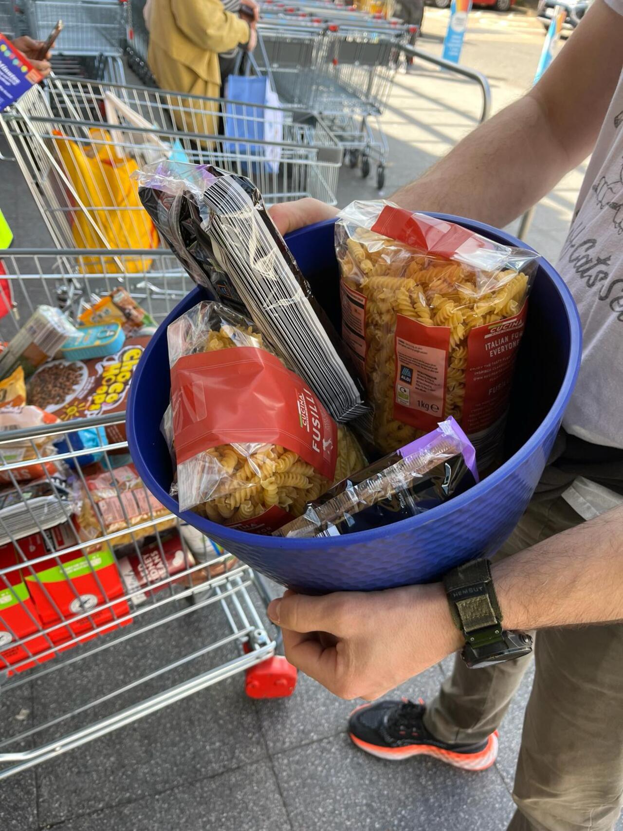 Public donating non perishables at a Shop and Drop Challenge