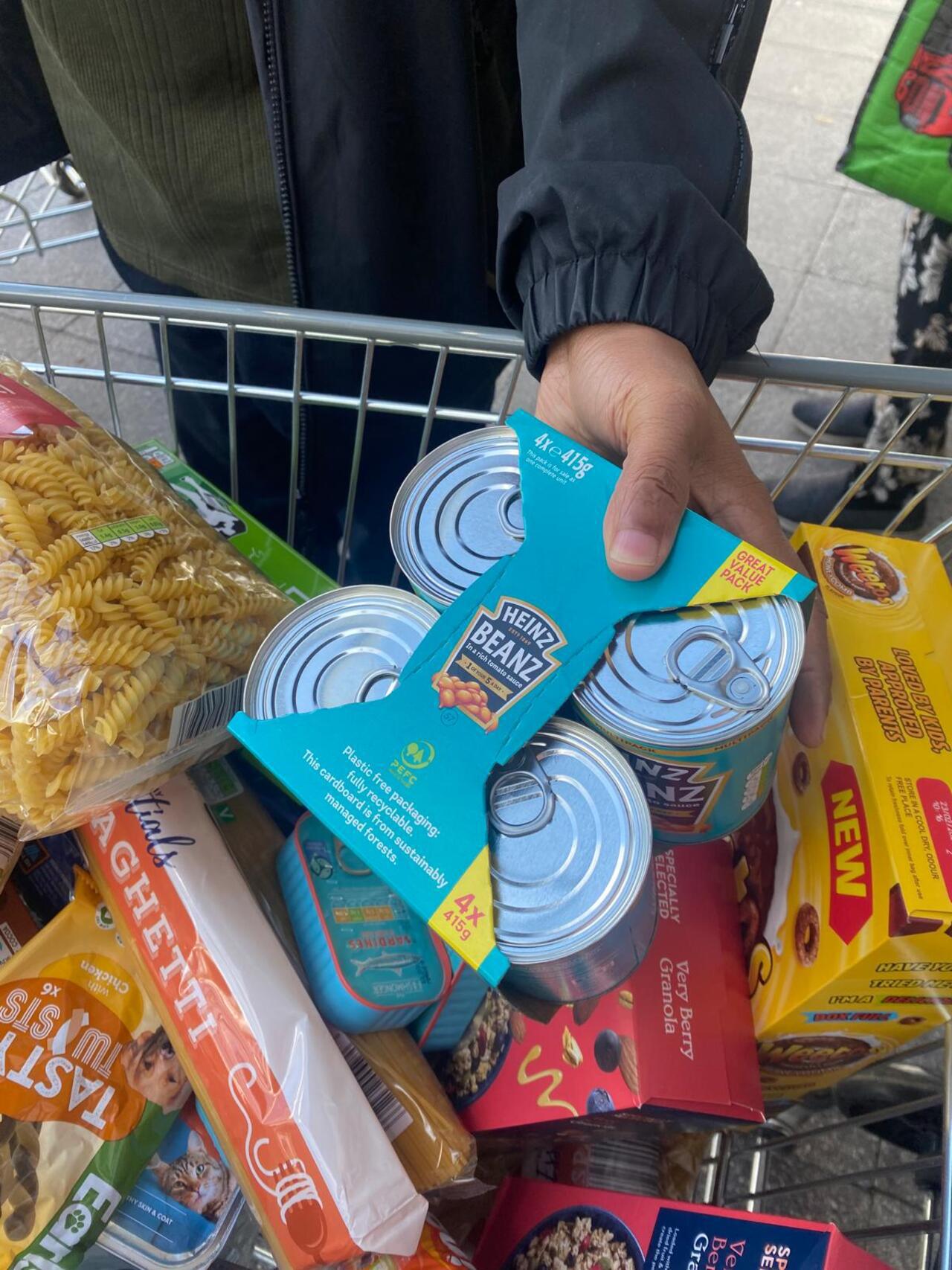 Public donating non perishables at a Shop and Drop Challenge