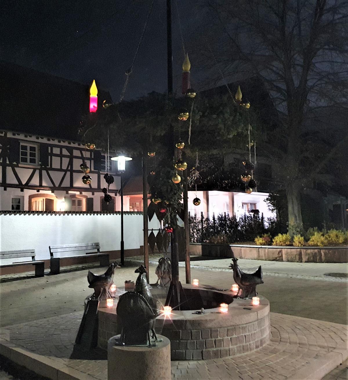 Anzünden der 1. Kerze am Dorfbrunnen