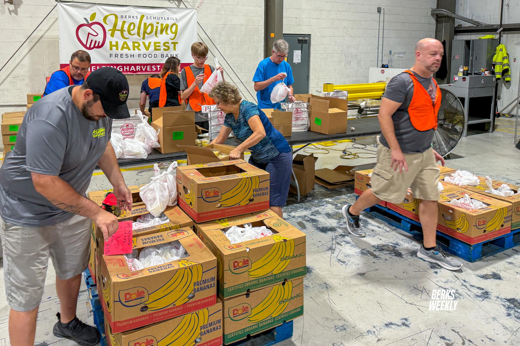 Volunteers pack Maternal Health Boxes at Helping Harvest, closing 2024 Urban Agriculture Tour