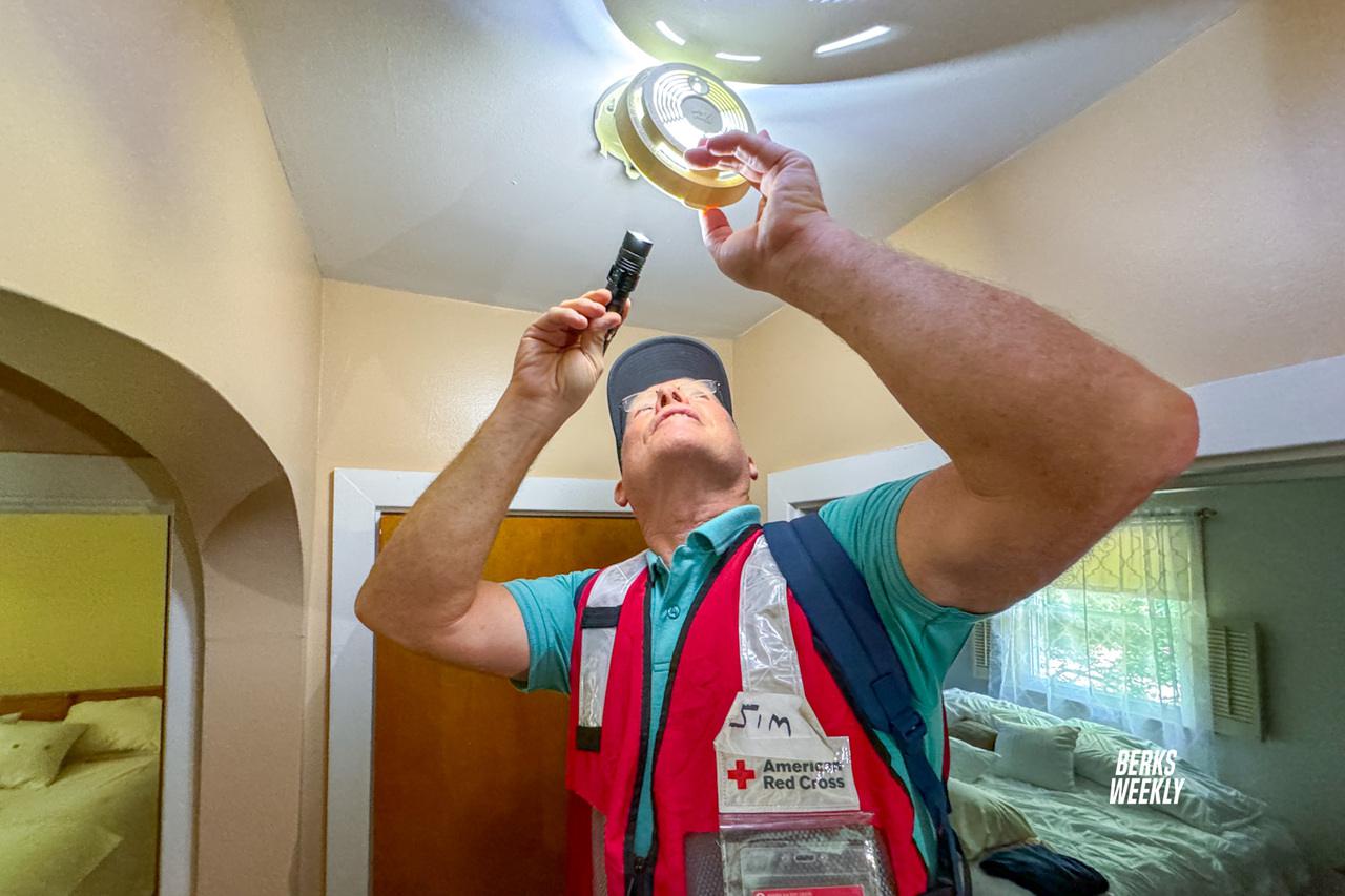 Red Cross volunteer Jim Fromuth installs smoke detectors in Wernersville