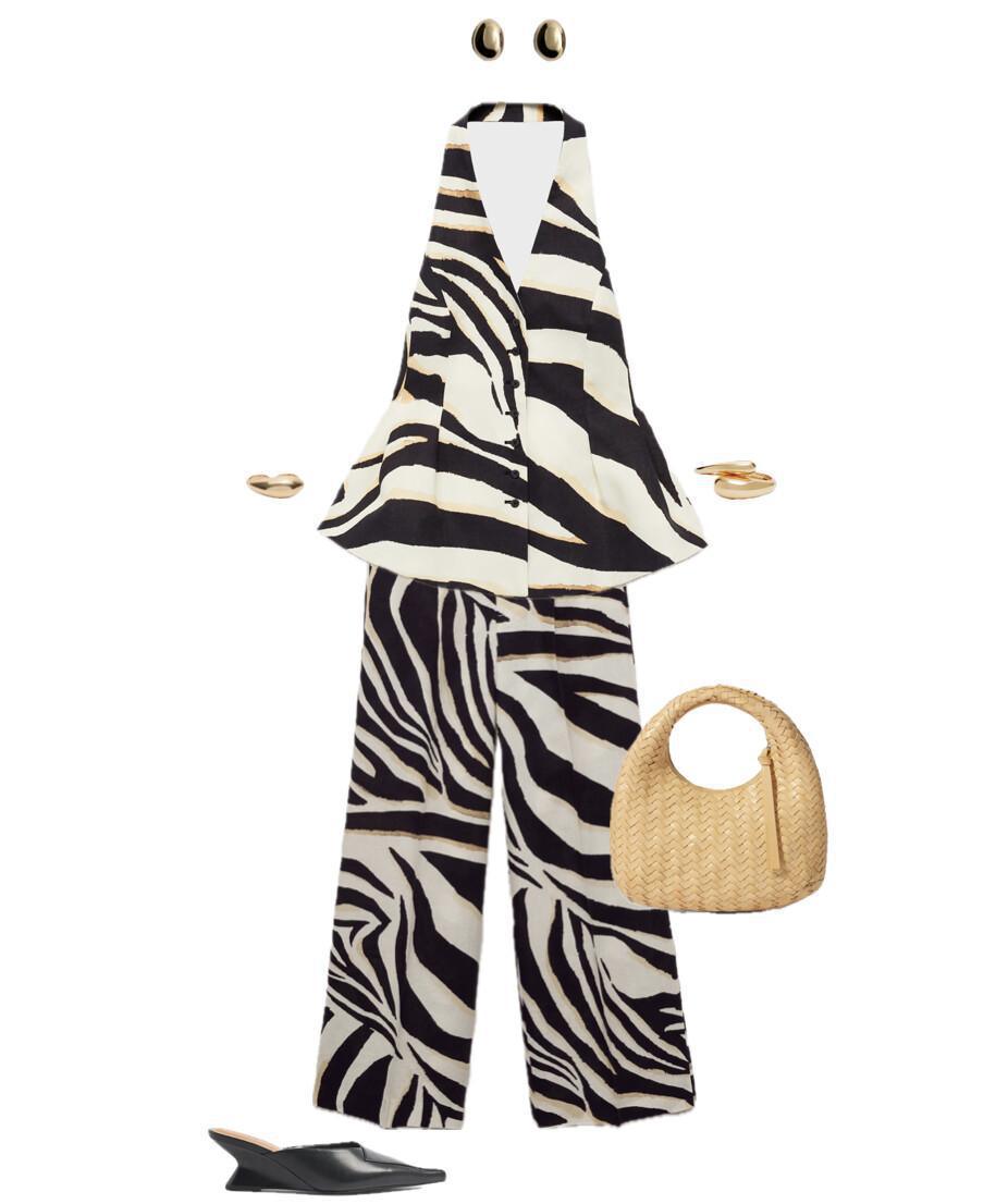 An outfit consisting of a set with a top and trousers featuring an animal print