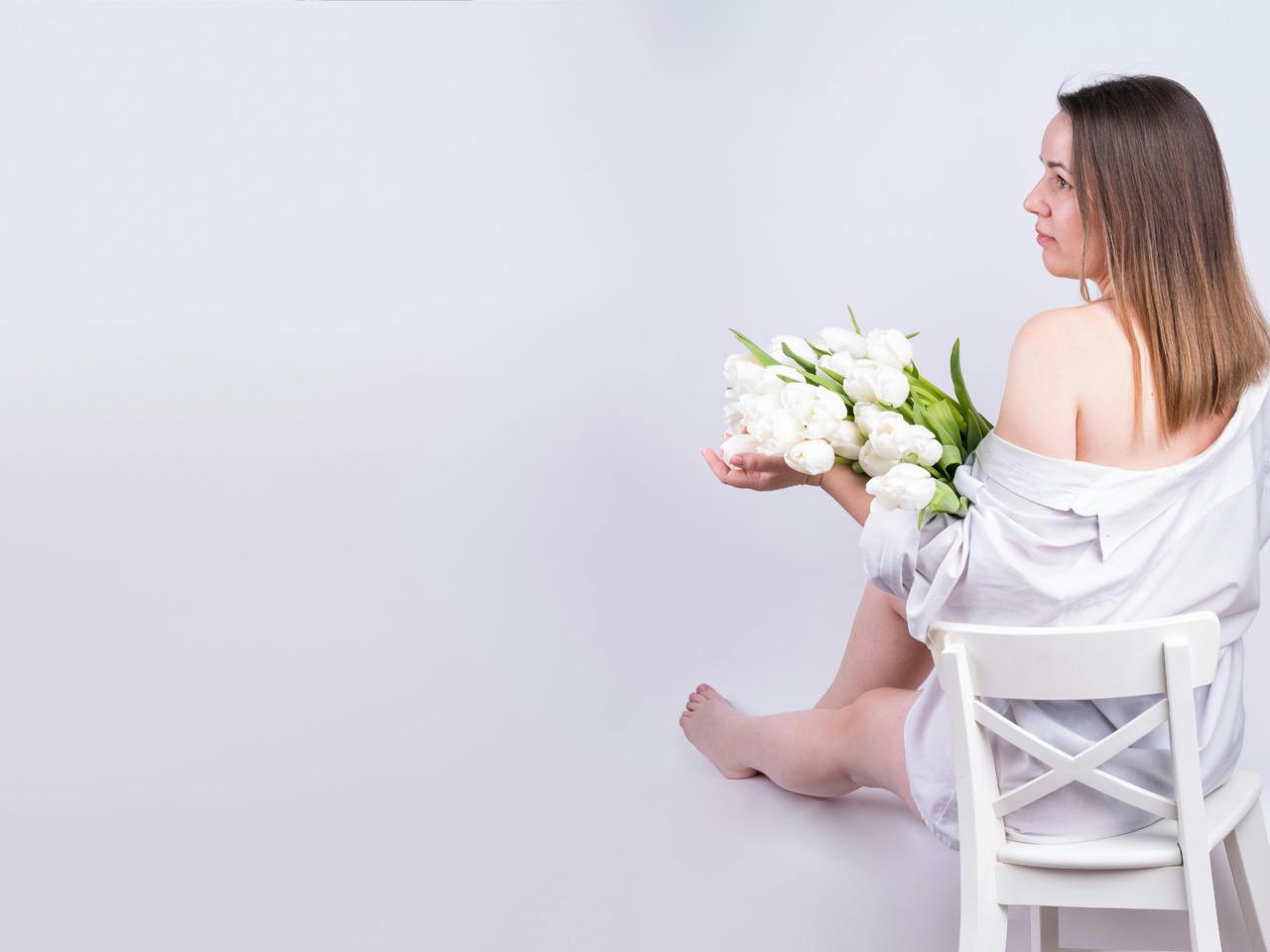 off the shoulder woman with tulips