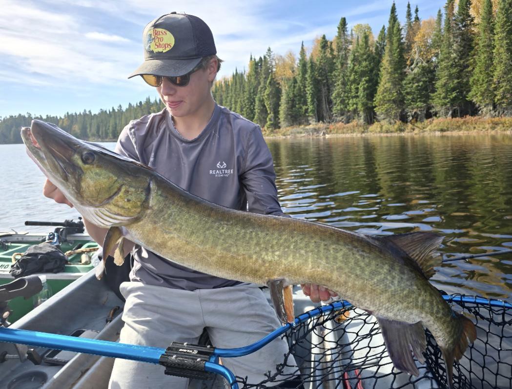 Laim with a nice muskie on mustang