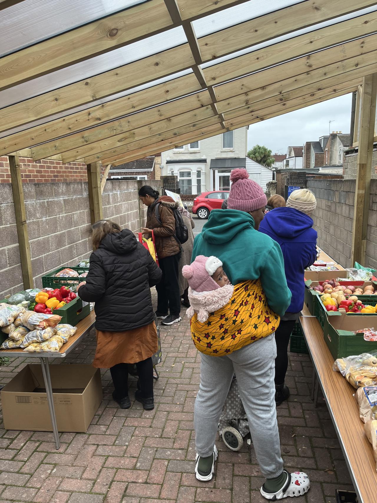 Volunteers display surplus food donations