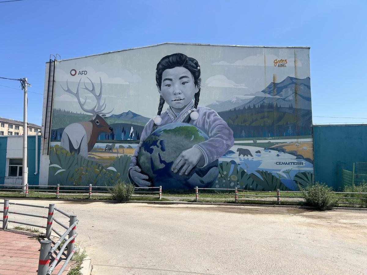 Girl Holding the Earth Mural