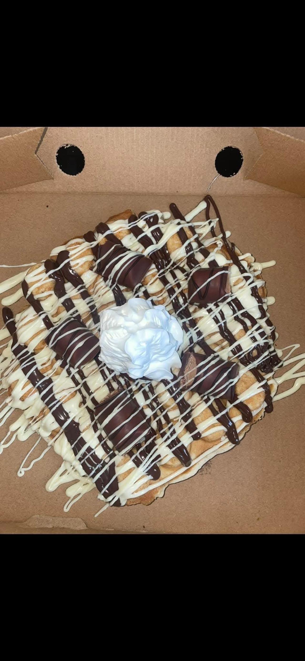 White and Dark chocolate sauce topped with Kinder Bueno