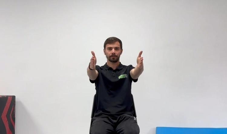 #21 Pe scaun – brațele întinse sus-jos (Seated arm raises up and down)