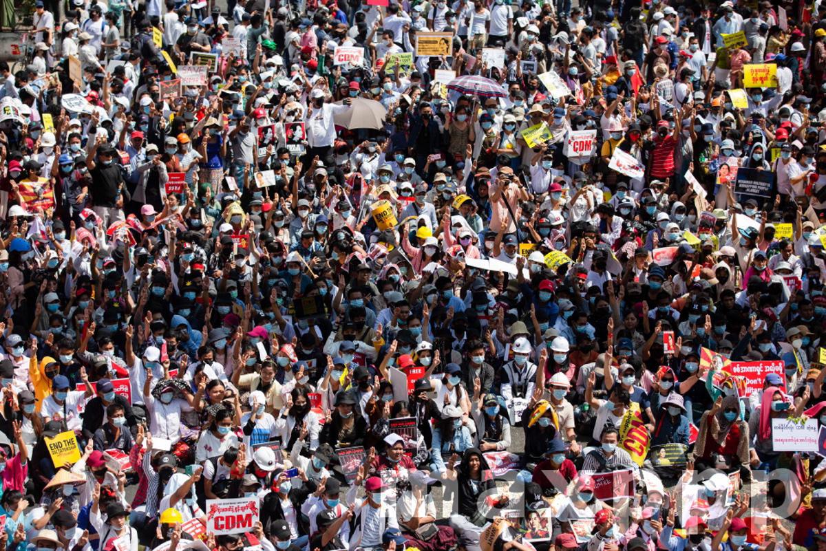 Protesters block a major road during military coup protests in Yangon, Myanmar