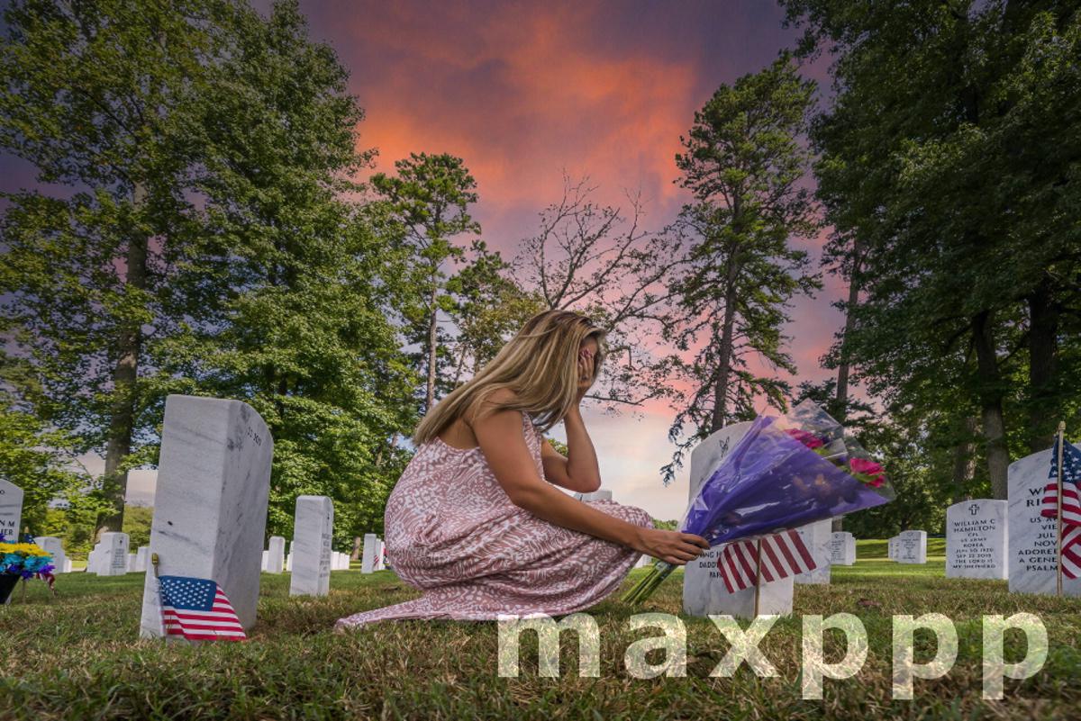 Fallen Family Member At A Military Cemetery