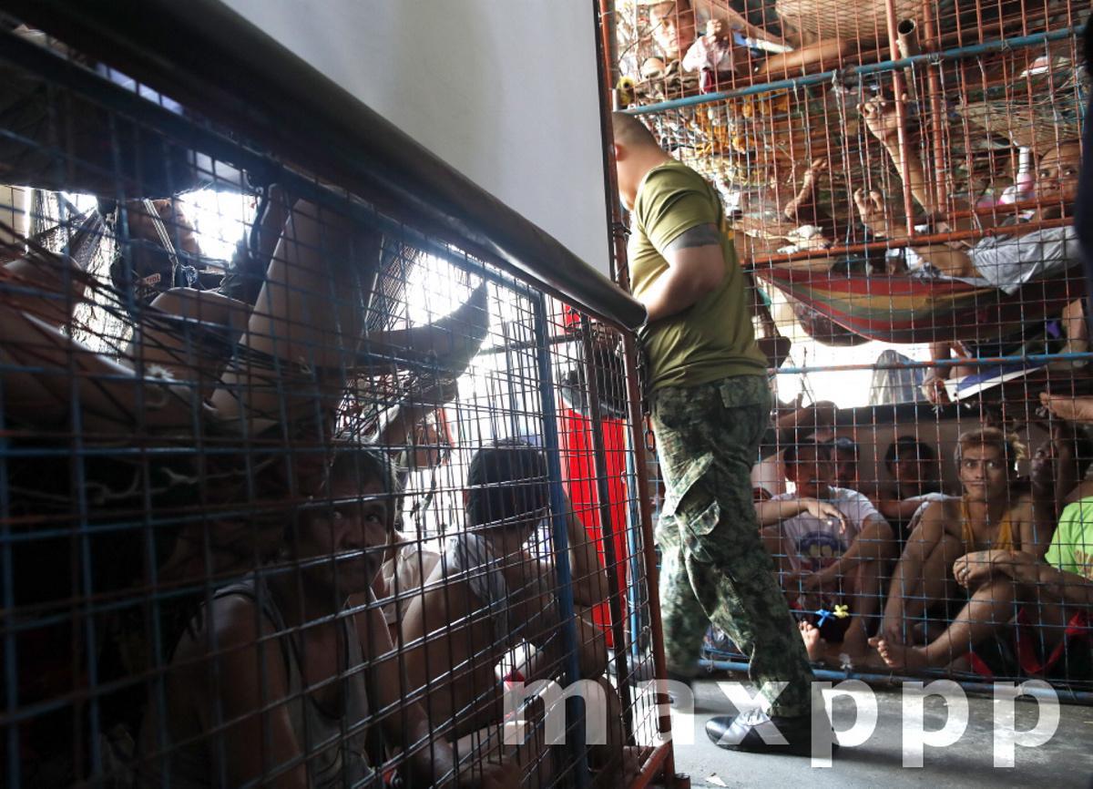 Inmates in overcrowded detention cells in Manila