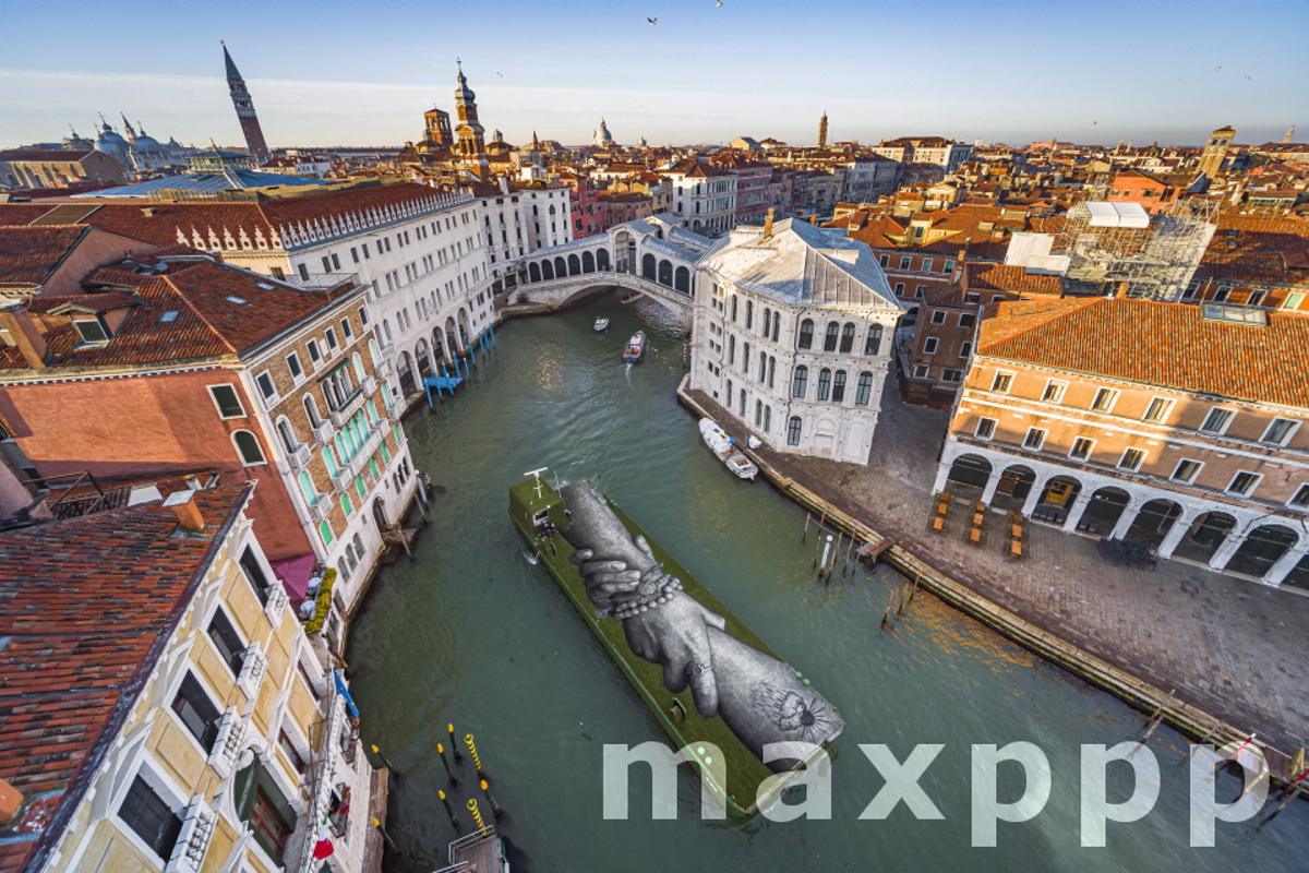 French-Swiss artist Saype shows giant biodegradable landart painting in Venice