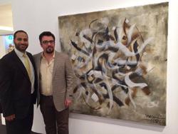 Moustafa Fahour (à gauche) avec Sabah Arbilli, le lauréat du Prix intenational de galigraphie devant l'une de ses oeuvres.