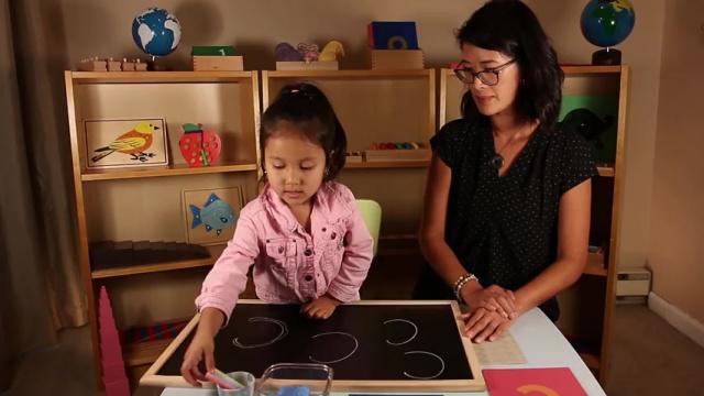 Writing Lesson 8 - Writing c and a on blackboard